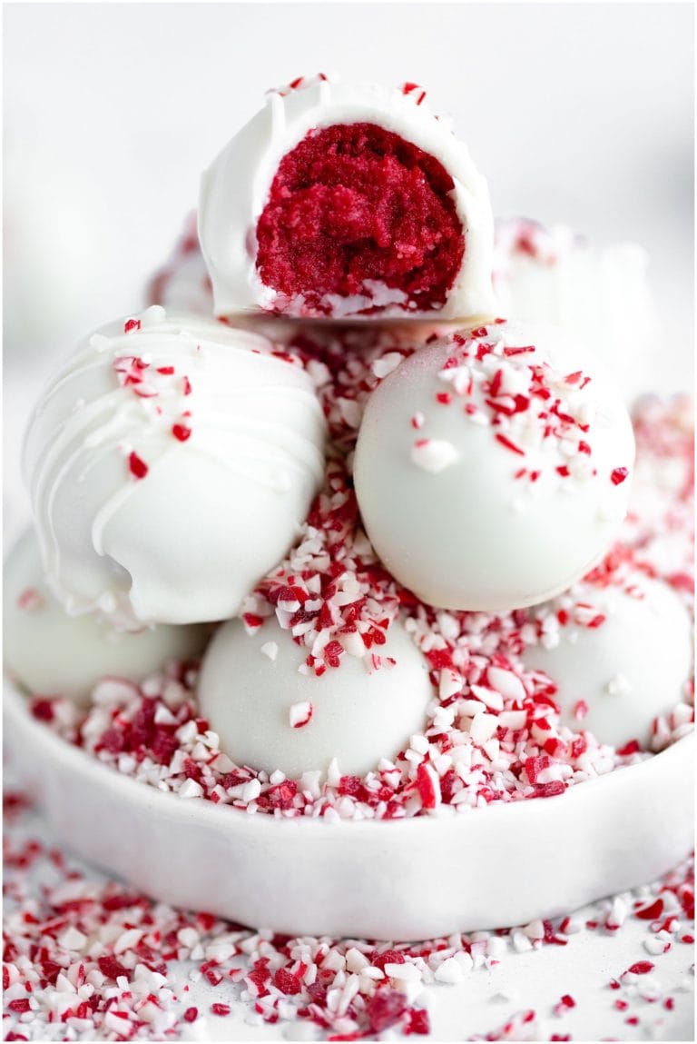 Sweet cherry chocolate truffles decorated with crushed peppermint candies, perfect for holiday gifts and celebrations.