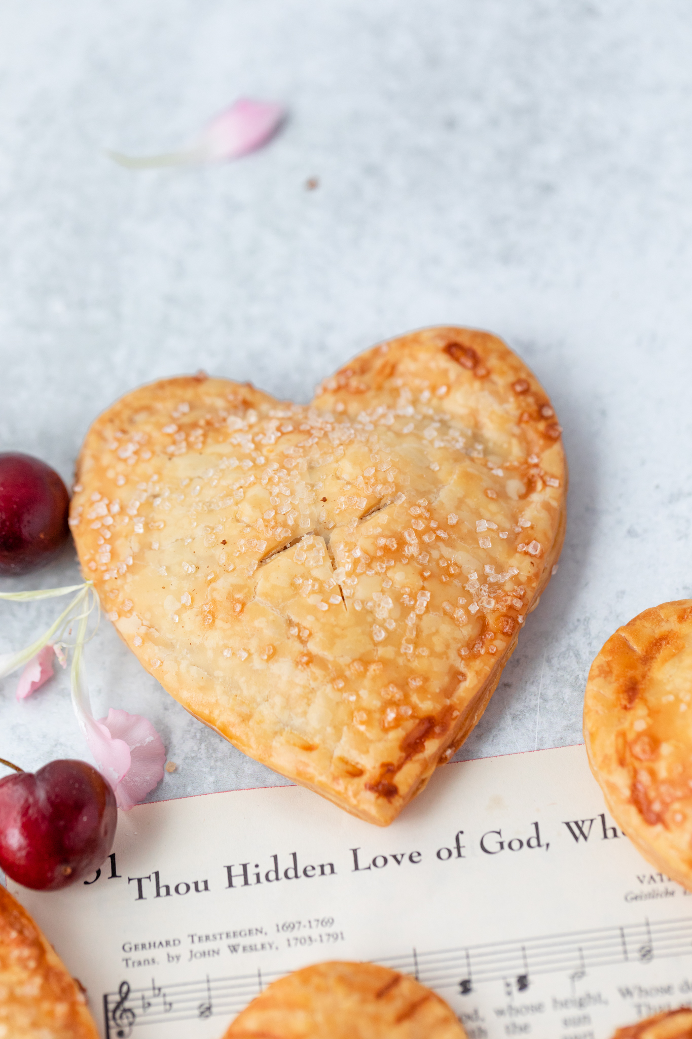 Heart Shaped Cherry Hand 
pies with jam and crystal sugar. 