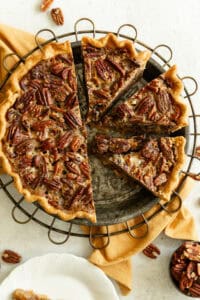 Buttery pecan pie with toasted pecans and a golden flaky crust, perfect for holiday desserts and gatherings.